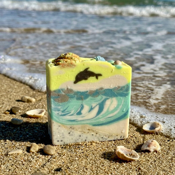 Bar of soap with ocean design on a beach